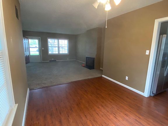 Dining room to living room; paint color has been updated to light grey.