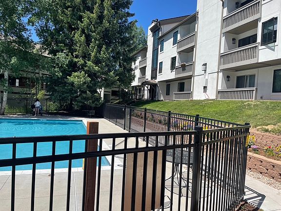 Entrance from lower parking lot off Lionsridge Loop. Balcony Overlooks Heated, Seasonal Pool