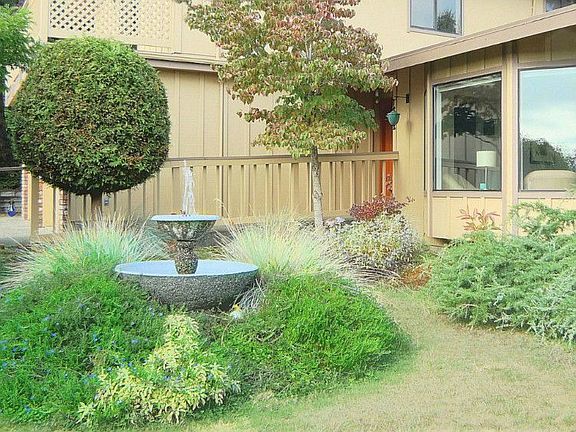 Property has mature landscaping, vegetable and flower gardens, fountain and storage building (not pi