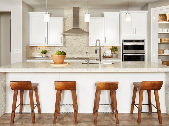The Kitchen is Complete with an Oversized Pantry and Plenty of Overhead Lighting