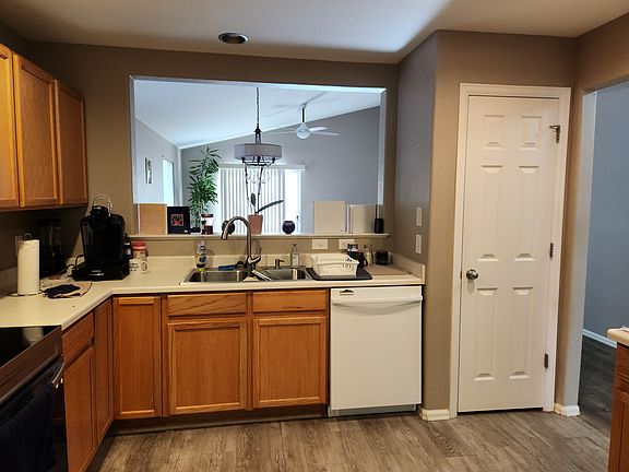 Kitchen has passthrough to dining area with pantry