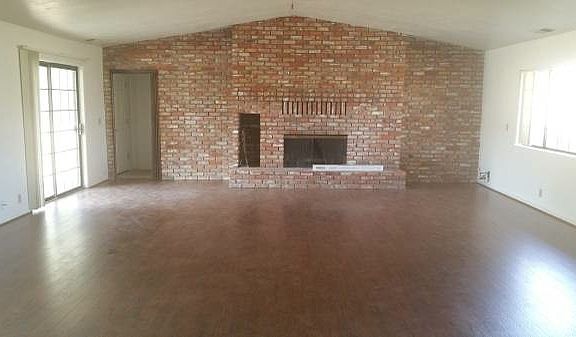Living room with brick fireplace