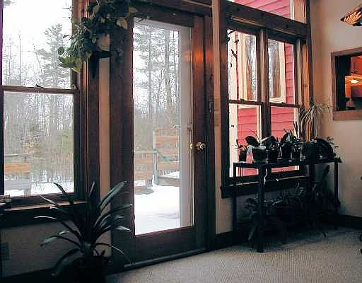 Sun room overlooks lg back deck & Pvt back yard