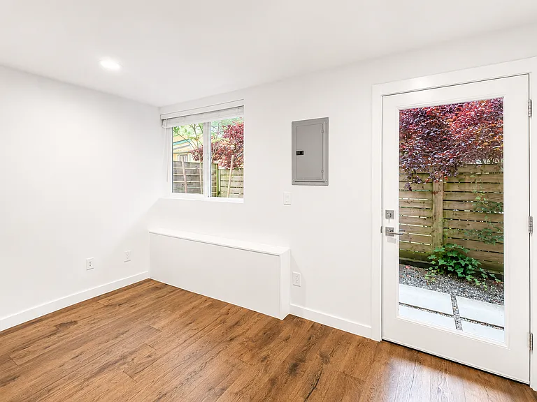 Bedroom #2 with access to back patio and great natural light