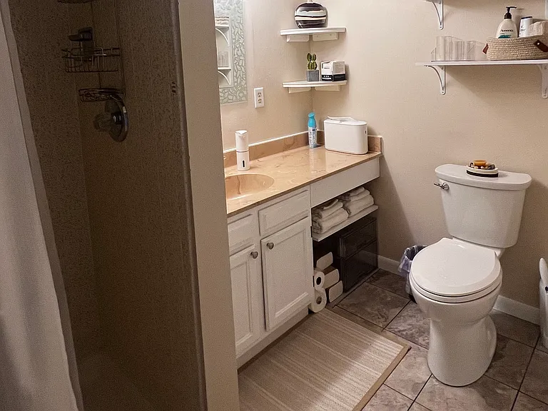 Private bathroom located just up a few steps on the lower level for your exclusive use. Has touchless soap dispenser, a hand towel dispenser, and toilet wand with disposable heads to maintain a sanitary environment in the bathroom.