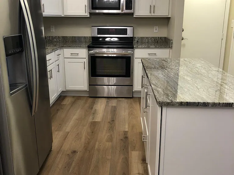 Granite countertops with tons of storage in the all new cabinets.