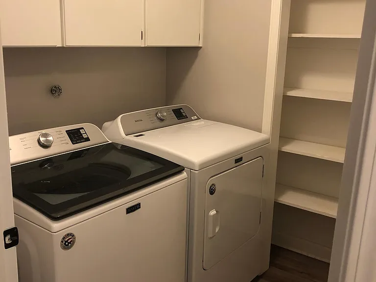 Laundry room with brand new/never been used washer and dryer