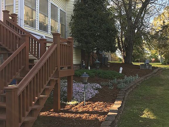 Flower bed beside deck steps