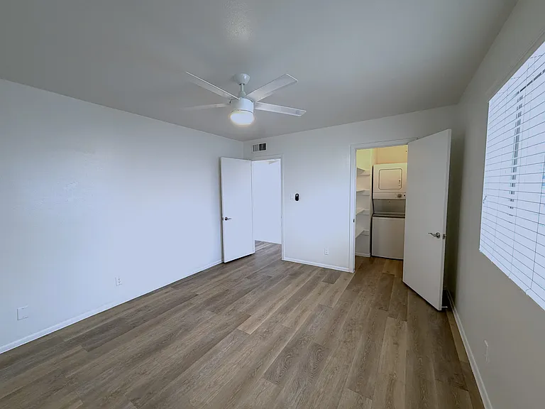 Bedroom with walk in closet and W/D