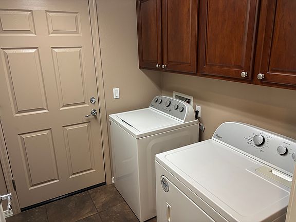 Laundry Room with washer and dryer and counter top.