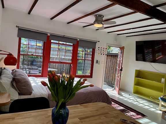 breakfast bar -new 65 inch hi pixel TV with Netflix. breakfast bar seats two,can double as a work table. full size fridge is also here but not pictured.