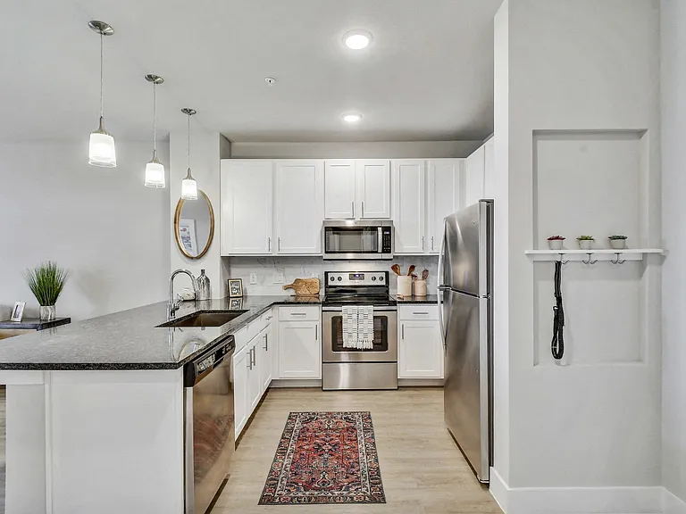 Our gourmet kitchens feature stainless steel appliances.