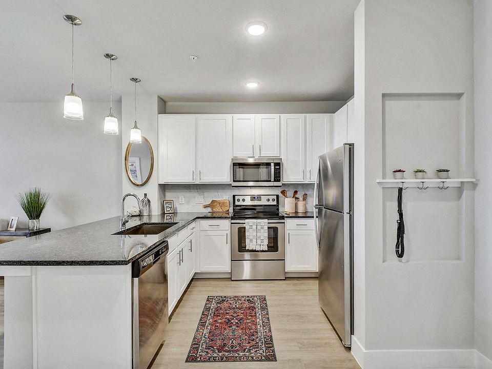 Our gourmet kitchens feature stainless steel appliances.