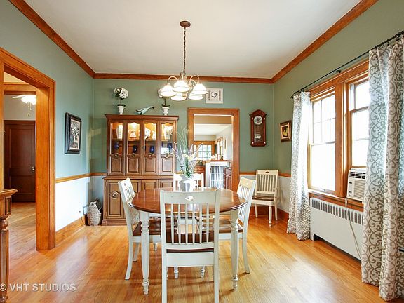 Dining Room with Hardwood floors and Crown Molding.
