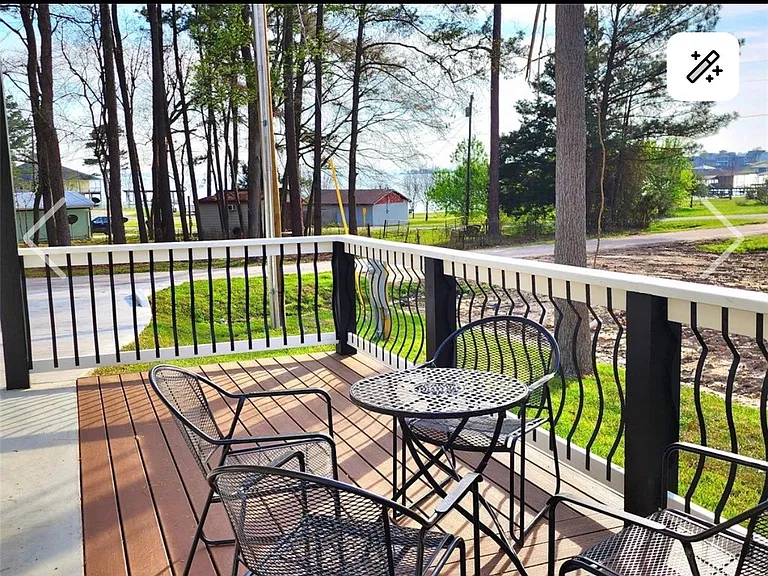 Side porch uncovered but can use covered parking with large fan to sit outside protected from sun or rain.