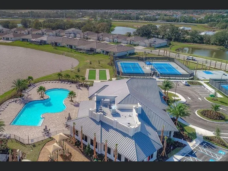 Beautiful amenity center includes 2 pools, splash pad for kids, multiple courts, bocce ball and restaurant/bar.