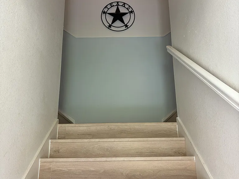 Hallway to M-4 and next door neighbor. One flight of stairs.