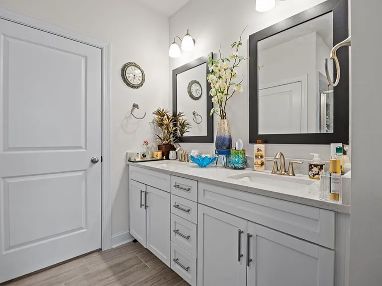 Downstairs master bathroom with dual sink and HUGE walk in closet