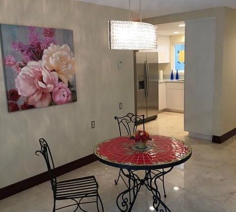 Dining area with beautiful chandelier available to buyer $400