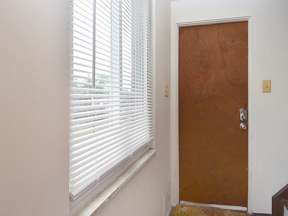 Front entry with electronic door locks for security & convenience.
