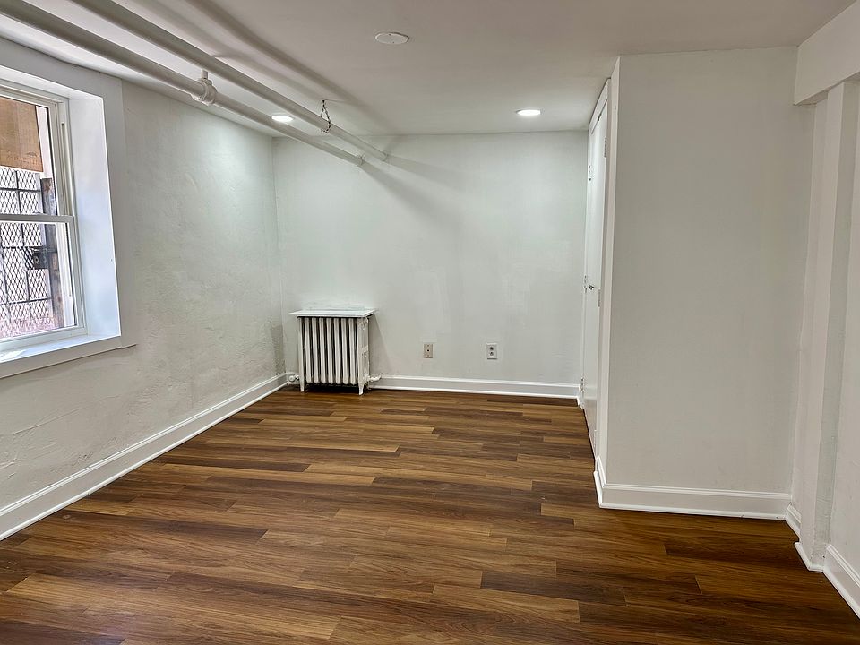 Cozy bedroom with hardwood flooring