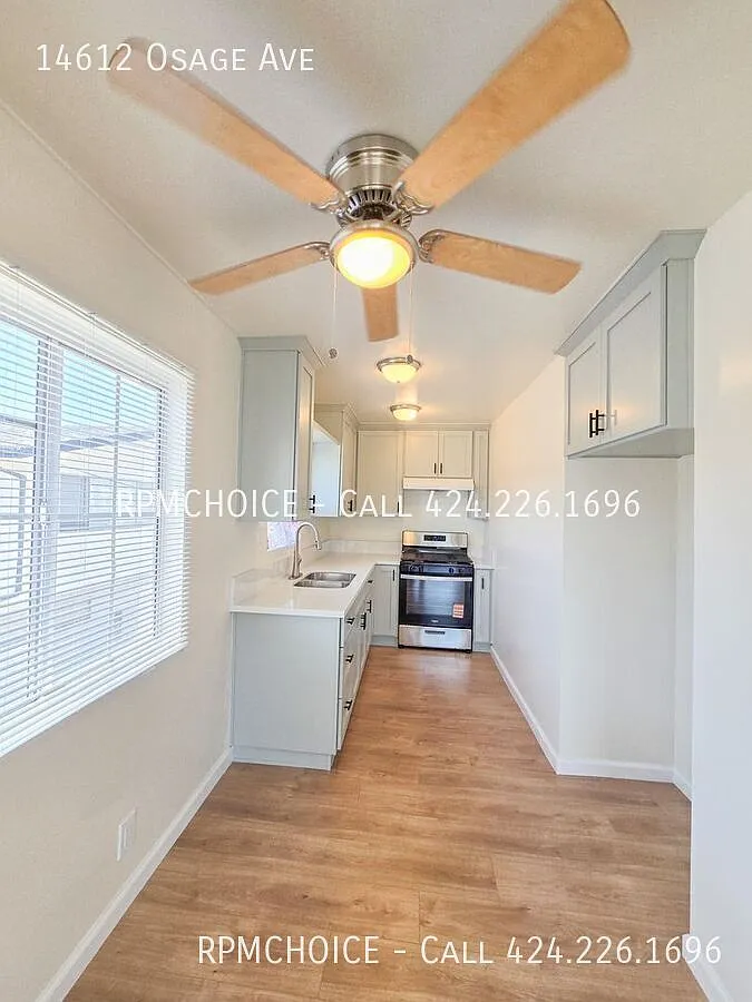Newly Remodeled 2bd/1ba 2nd Floor Unit with Large 1 Car Garage, Balcony, & Laundry Room — Photo 3