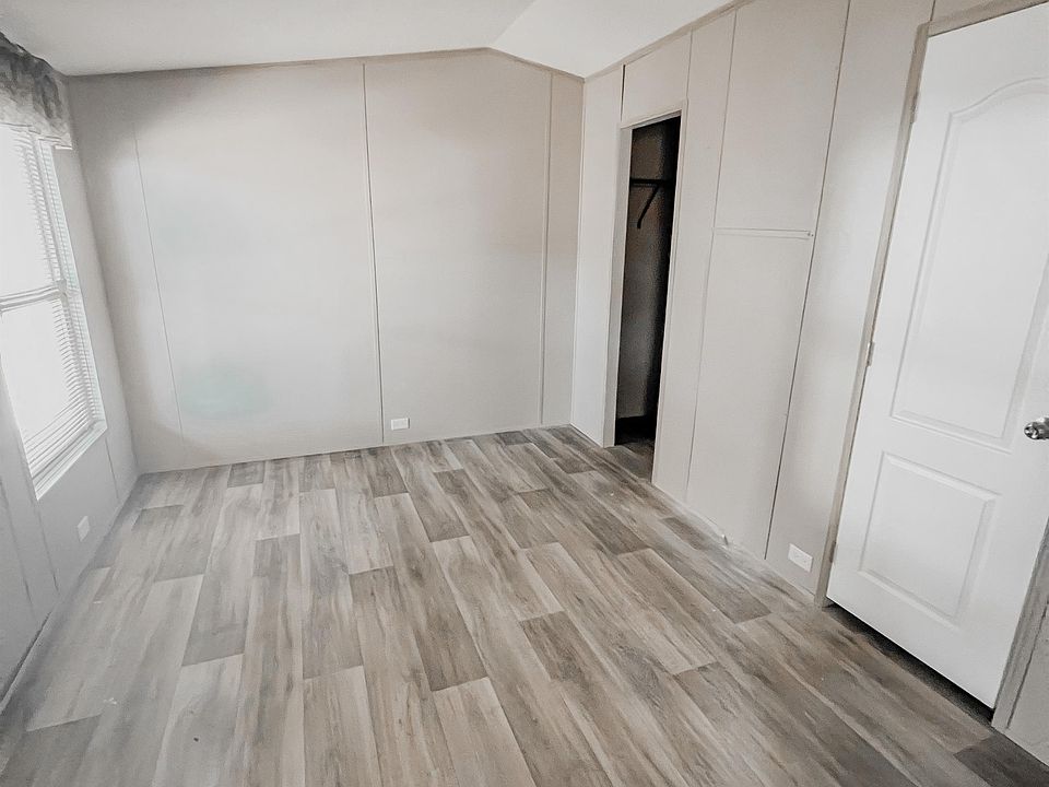 Spacious primary bedroom with natural light and a large walk-in closet your perfect retreat.