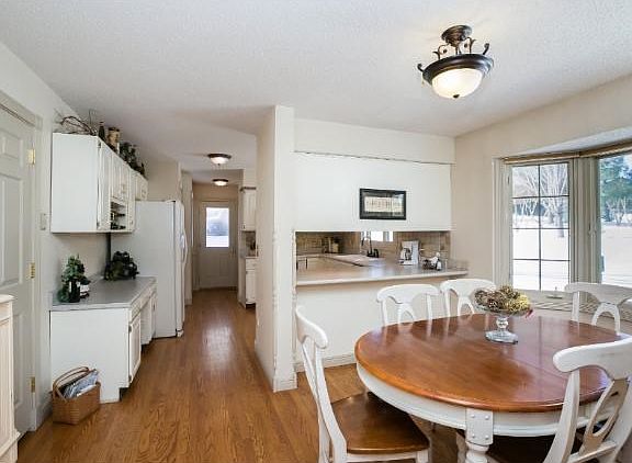 Kitchen has an informal dining area with a huge bay window overlooking the backyard.  The kitchen is open to the family room and has a separate door leading outside to the patio.