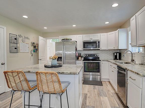Fabulous updated kitchen with Marble countertops and SS Appliances.
