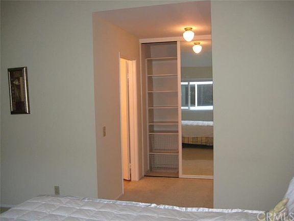 View of one of the master closets with the shelves