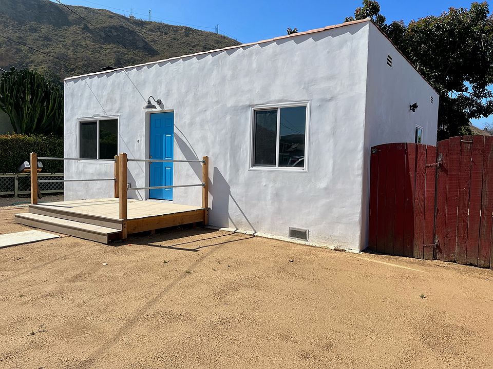 Front porch overlooking drought tolerant front yard