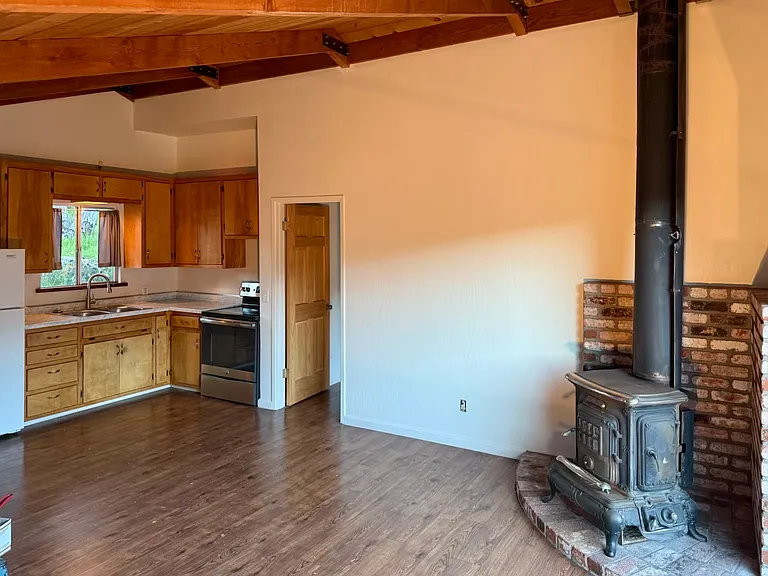 Great Room with free-standing, cast iron, wood burning fireplace
