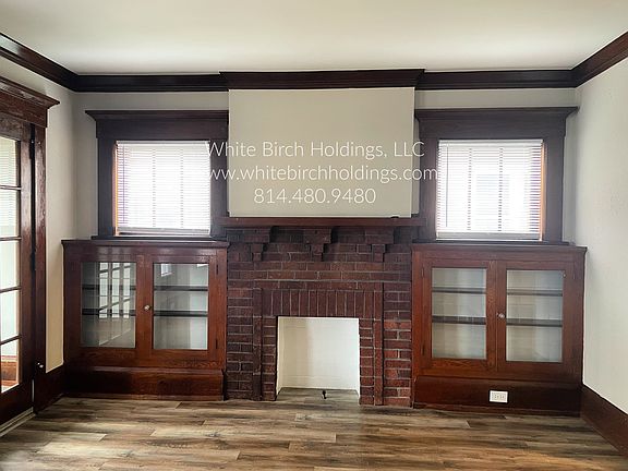 Built in book cases & decorative fire place in Living Room