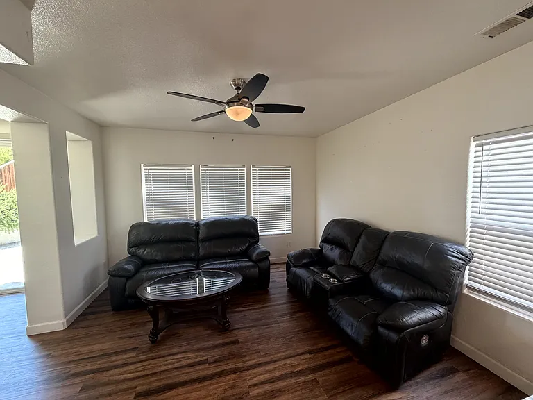 Open-concept area adjacent to the kitchen, ideal for dining or casual living.