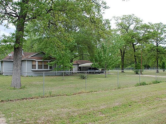 Newer 6ft chain link fence fully encloses property.