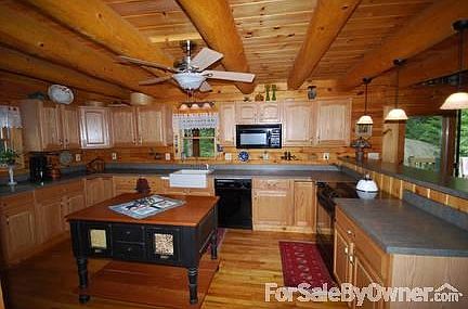 Kitchen
						:
						Features a porcelain farm sink