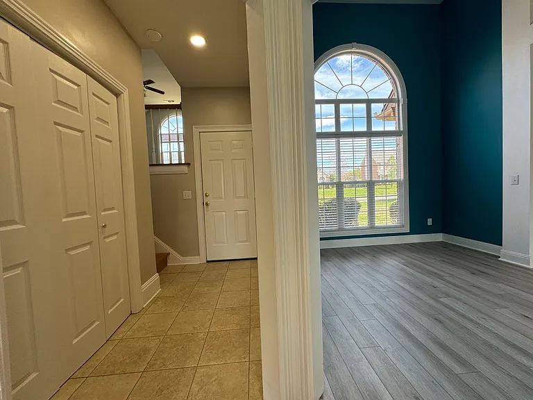 View of Laundry Room hallway which leads to the bonus room and on the right is the dining Room