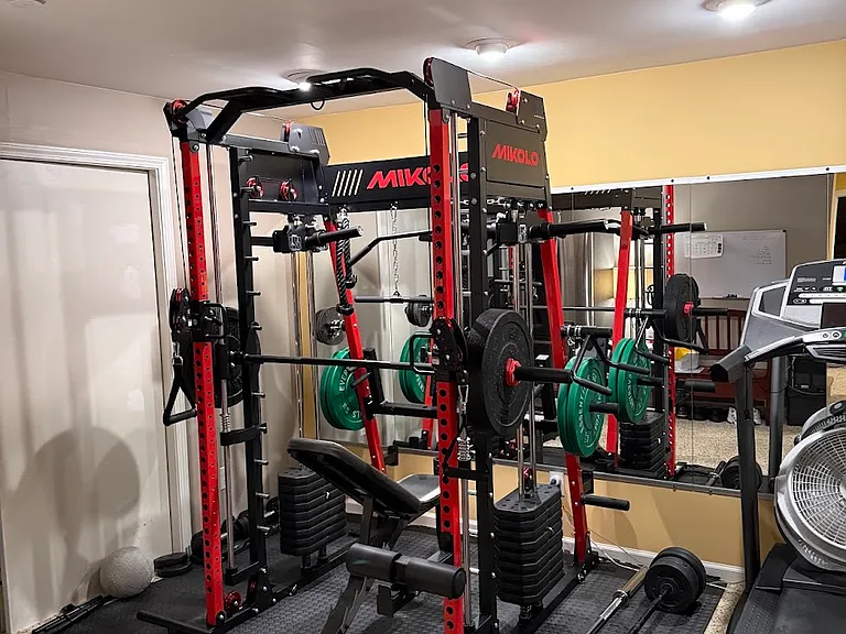 Kitted out gym with Power Rack, Smith Machine, Cable Machine, Treadmill, Freeweights, etc. We've even got a full sized fridge to store drinks!