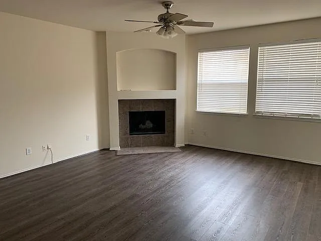 Living area with fireplace and luxury vinyl plank