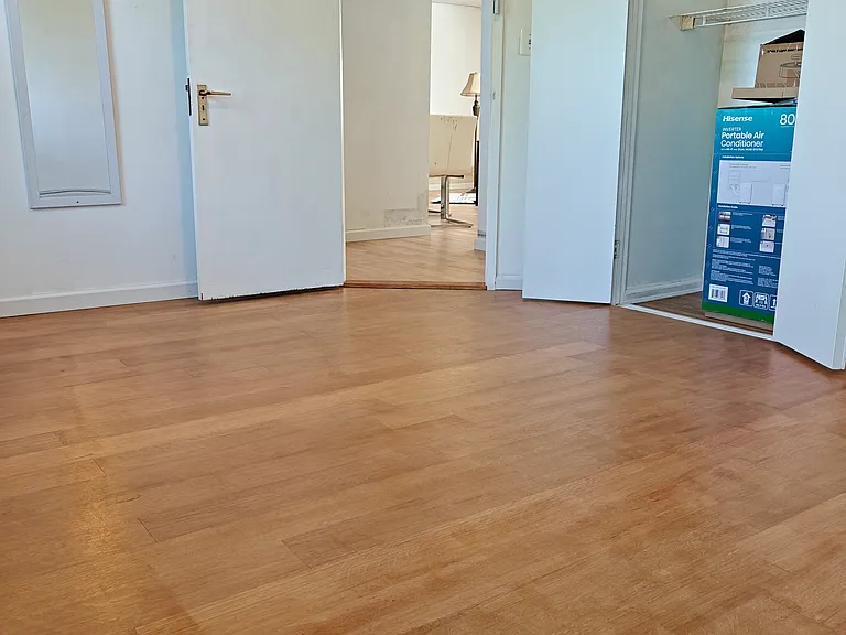 West facing bed room with freshly installed 5" wide hardwood flooring.