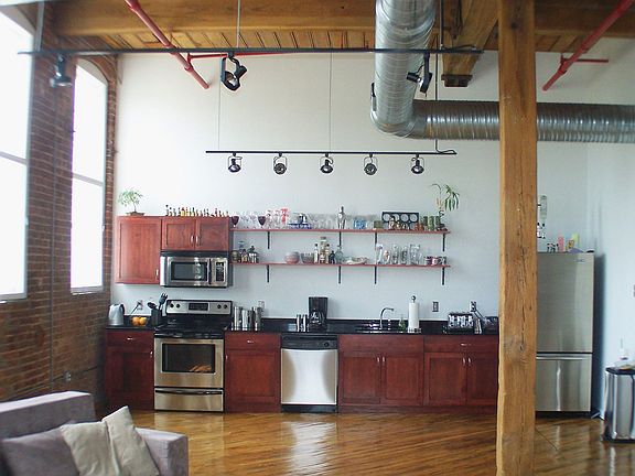 Natural lighting throughout home enhances casual atmosphere. Stainless steel a