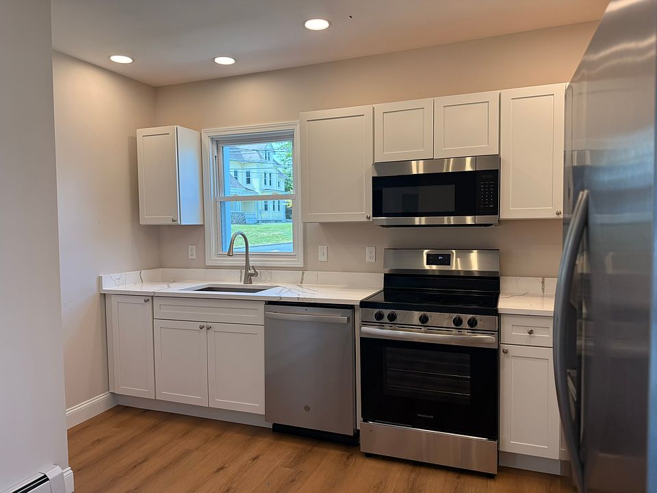 KITCHEN - all brand new appliances, fixtures, finishes, windows. Sizable kitchen lots of cabinet/storage space, brand new cabinets, quartz countertops, and wonderful lighting.