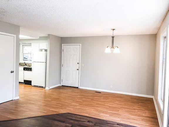 Dining area, kitchen and front door