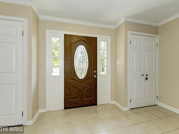Entrance with double coat closets