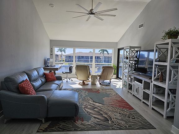 Vaulted ceilings overlooking the canal. Have a drink overlooking the water. A 64" TV to relax to after a long day in the beautiful weather.