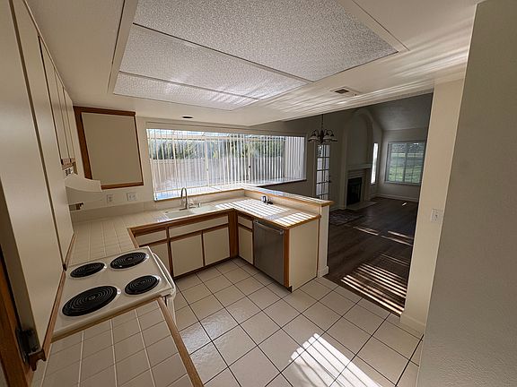 kitchen looking to yard and living area