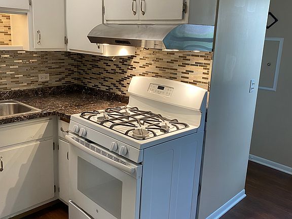 U-shaped kitchen off living room