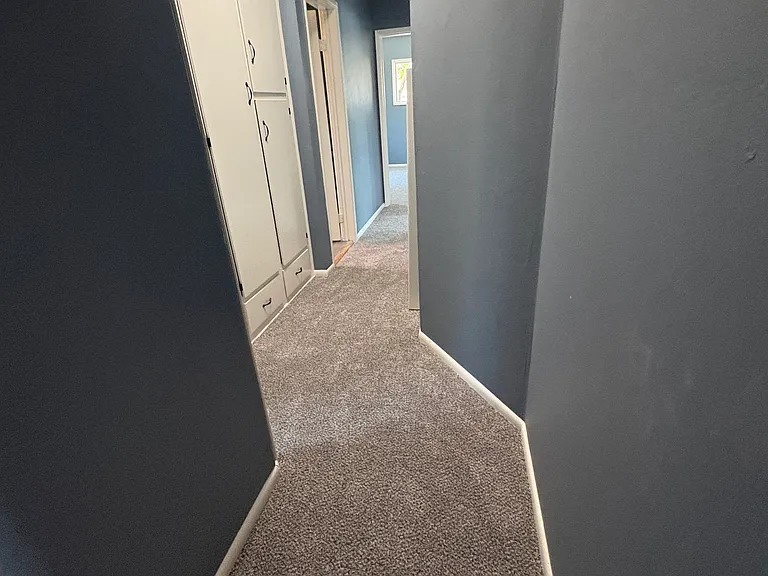Long Hallway W/ Closet Space & Access to Garage