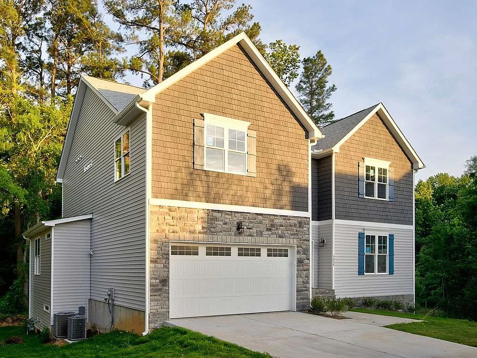 House: The property for rent is entered through the back of the garden.