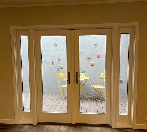 Living room opening to patio (furniture included)